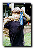Boy holding blue ribbon